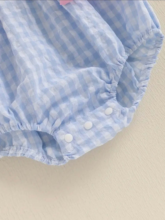 Light blue gingham baby romper detail with elastic gather and snap buttons for easy dressing.