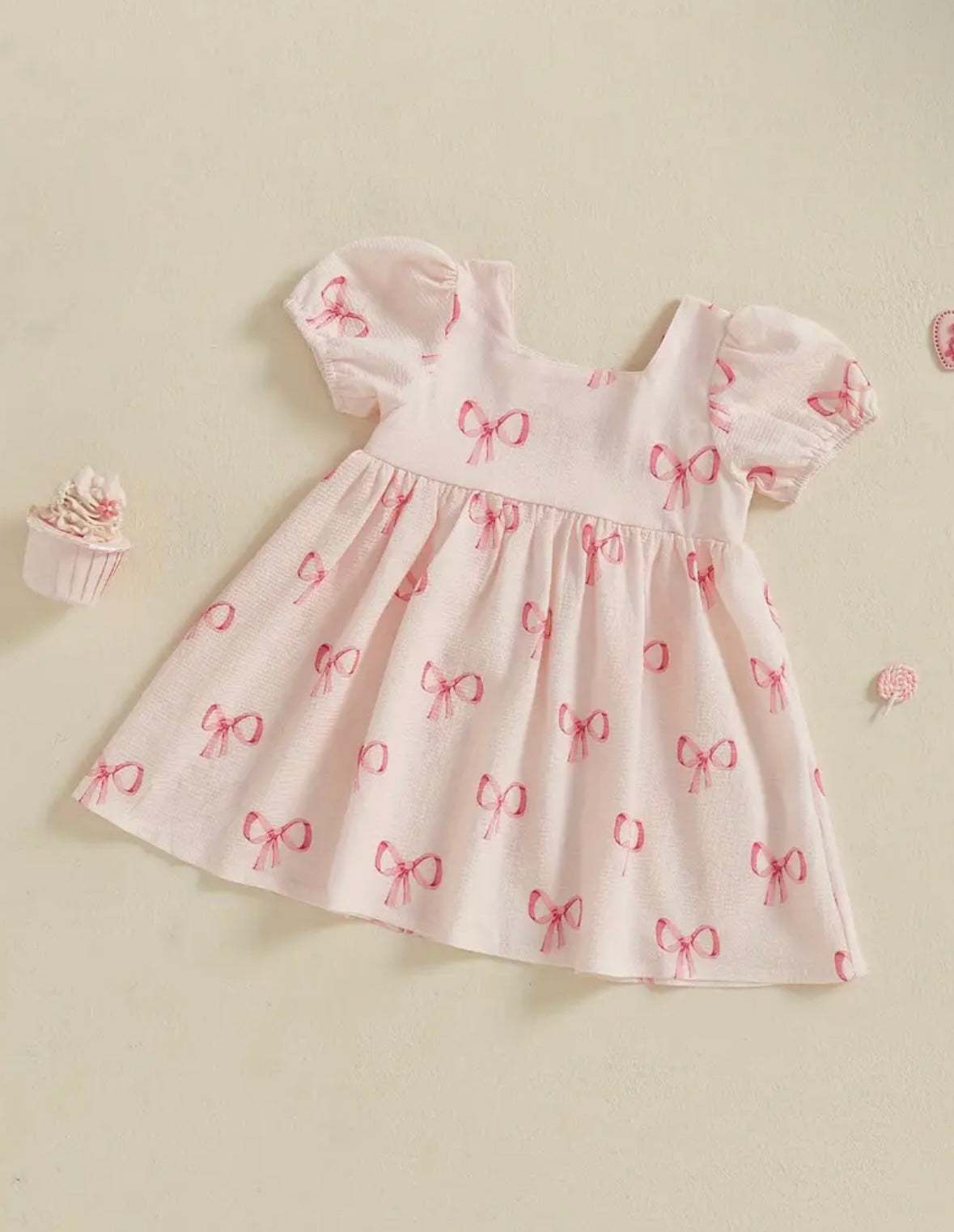 Pink Puff Sleeve Baby Dress with Allover Bow print