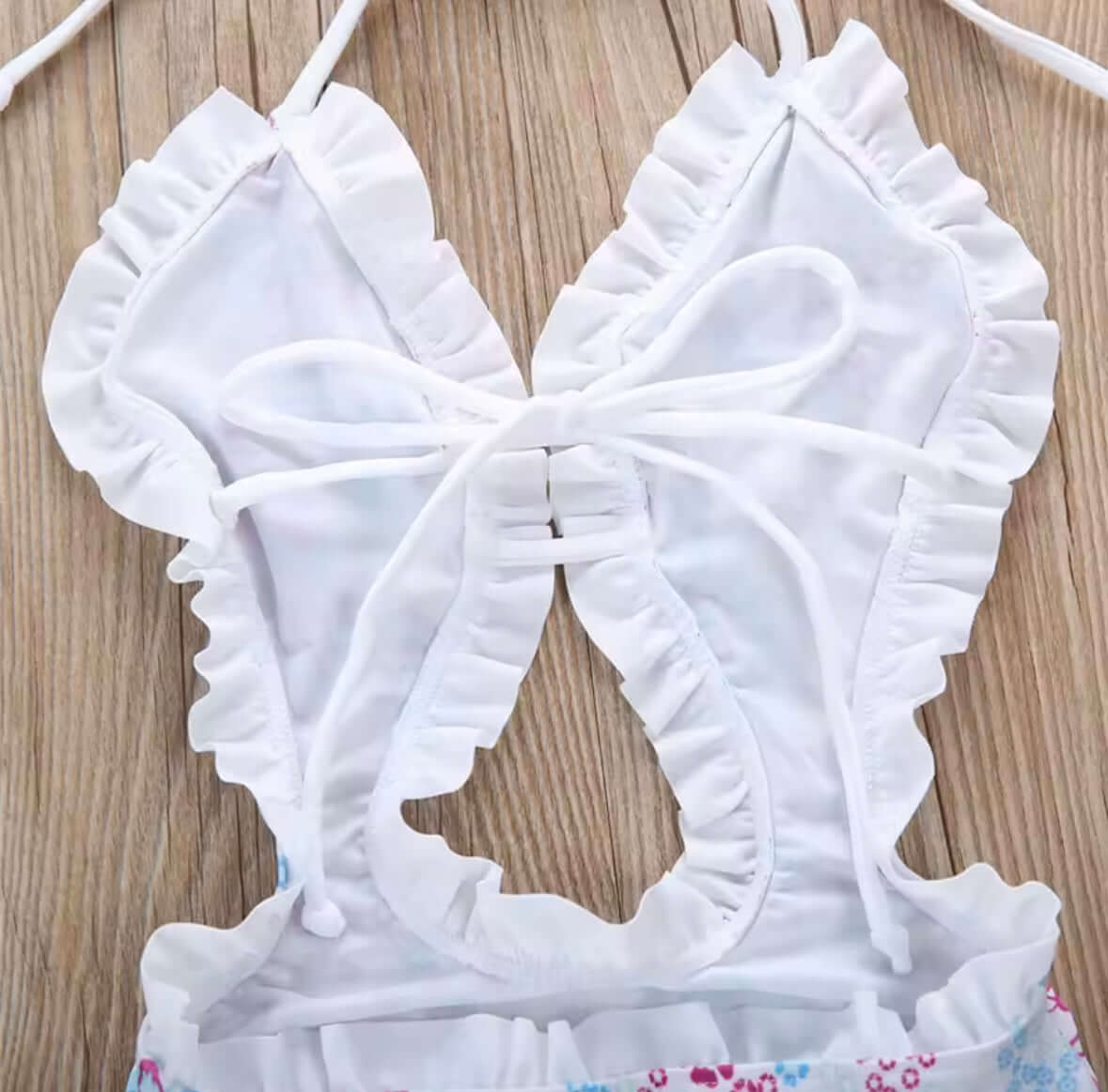 Girls’ Floral One-Piece Swimsuit with Ruffle Trim – Cutout & Halter Neck