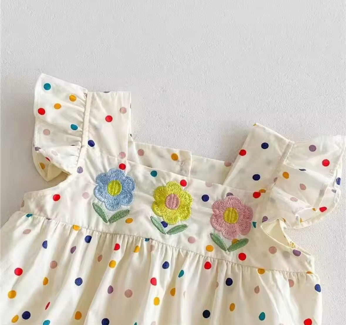 Rainbow Dot Ruffle Romper – Baby Girl One-Piece with Floral Appliqué