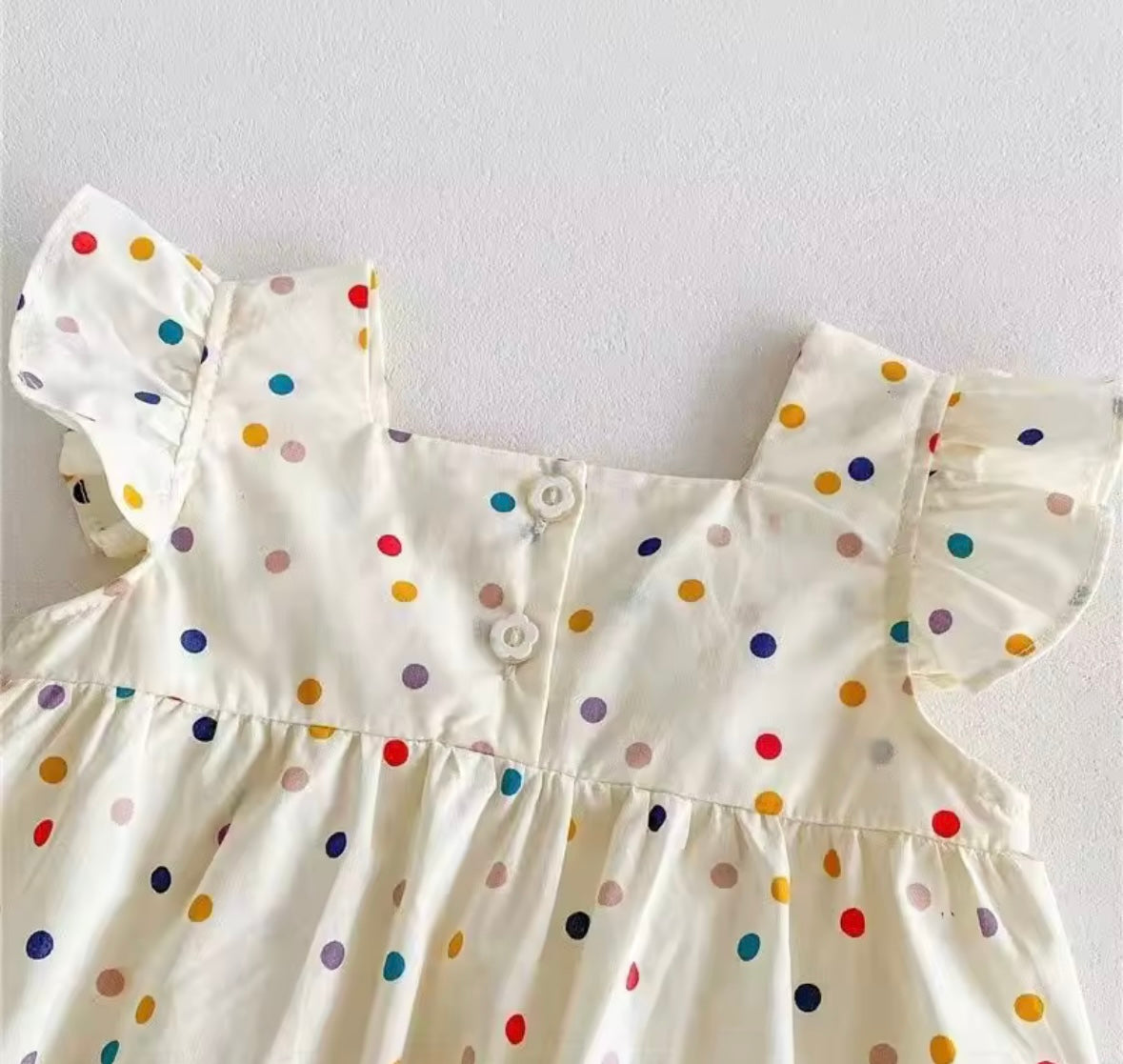 Rainbow Dot Ruffle Romper – Baby Girl One-Piece with Floral Appliqué