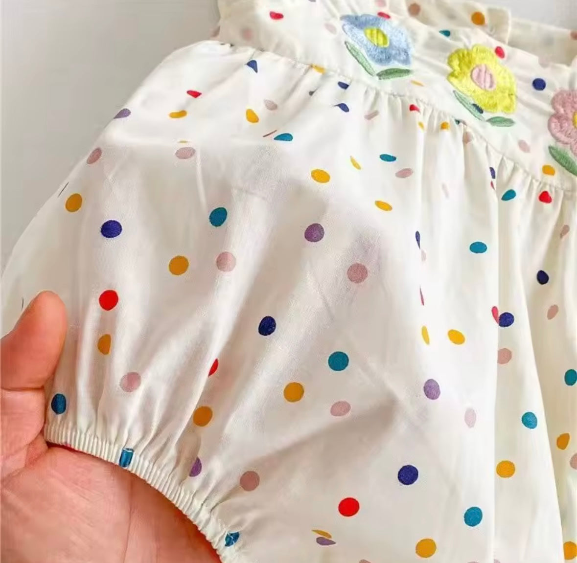 Rainbow Dot Ruffle Romper – Baby Girl One-Piece with Floral Appliqué