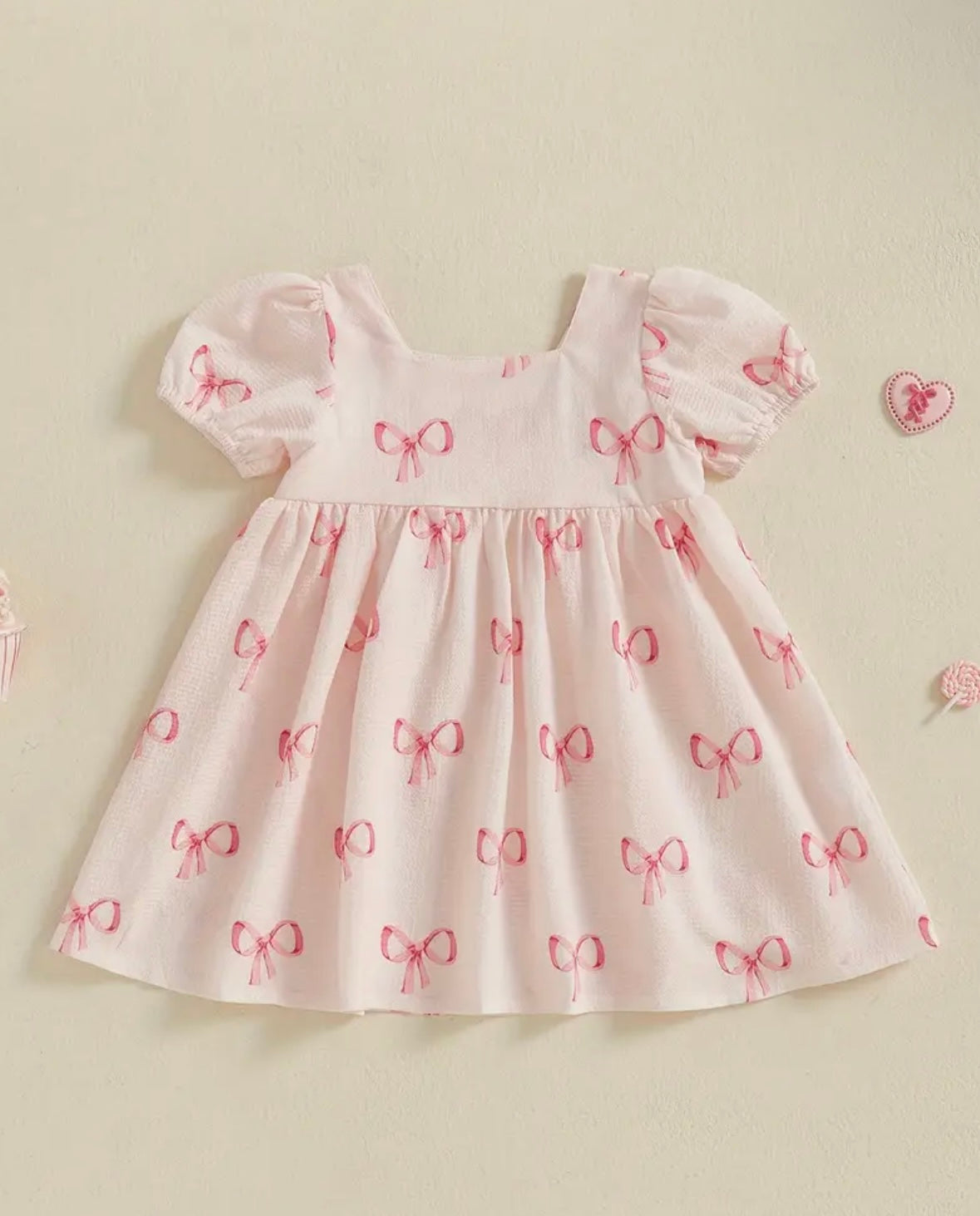 Pink Puff Sleeve Baby Dress with Allover Bow print