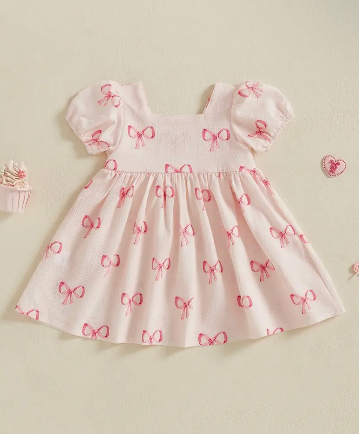 Pink Puff Sleeve Baby Dress with Allover Bow print