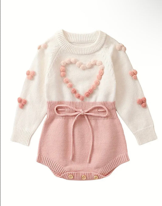 Pom-Pom Heart Knit Baby Romper – Blush & Cream. Available in sizes:  0-3m,  3-6m , and  9-12m