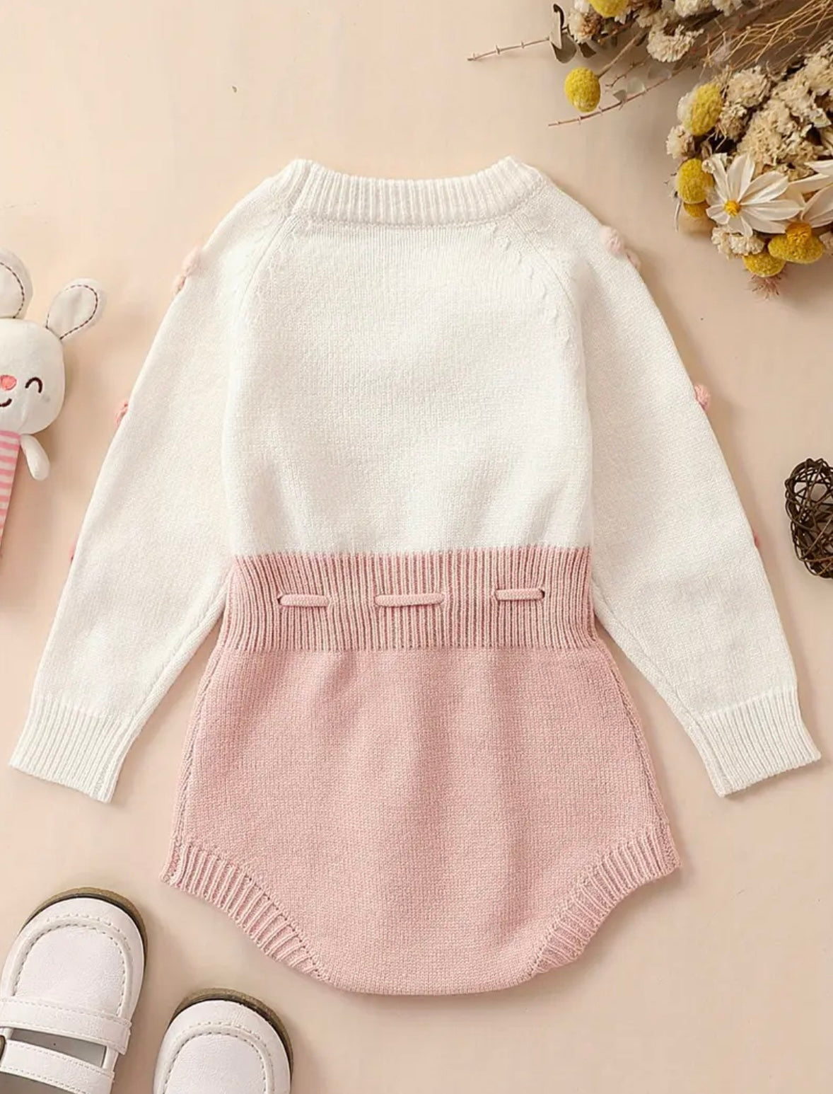 Pom-Pom Heart Knit Baby Romper – Blush & Cream. Available in sizes:  0-3m,  3-6m , and  9-12m