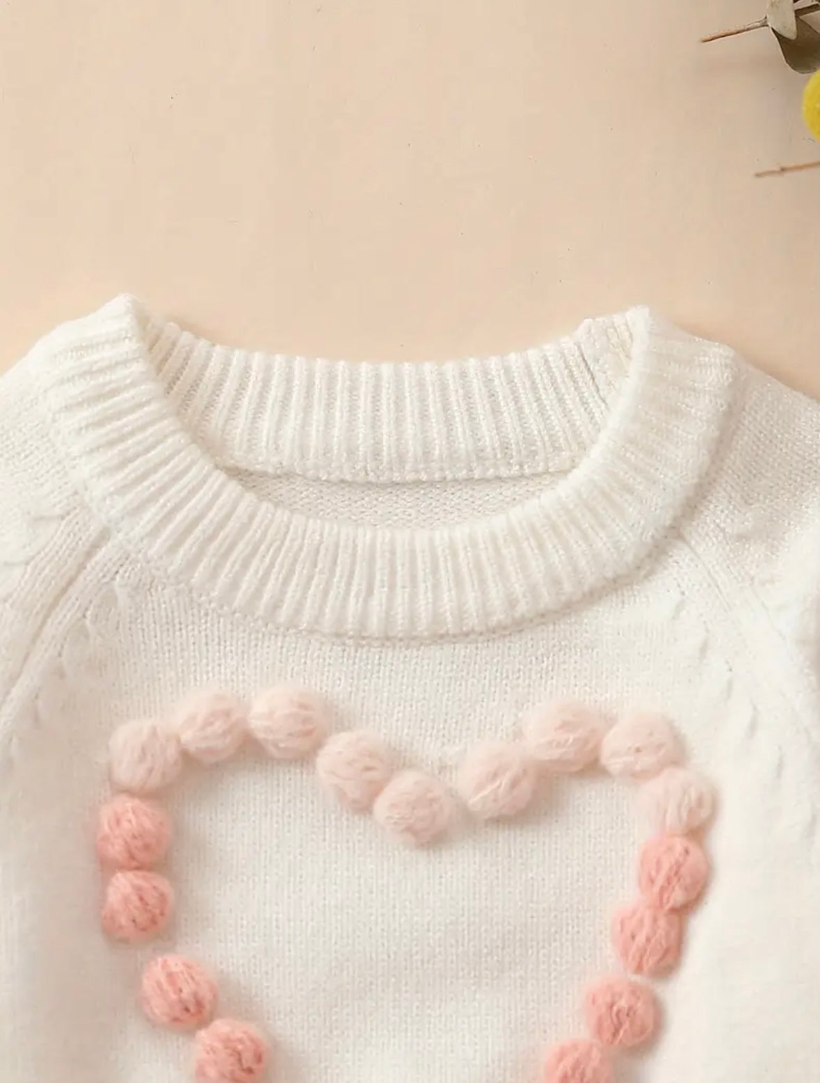 Pom-Pom Heart Knit Baby Romper – Blush & Cream. Available in sizes:  0-3m,  3-6m , and  9-12m