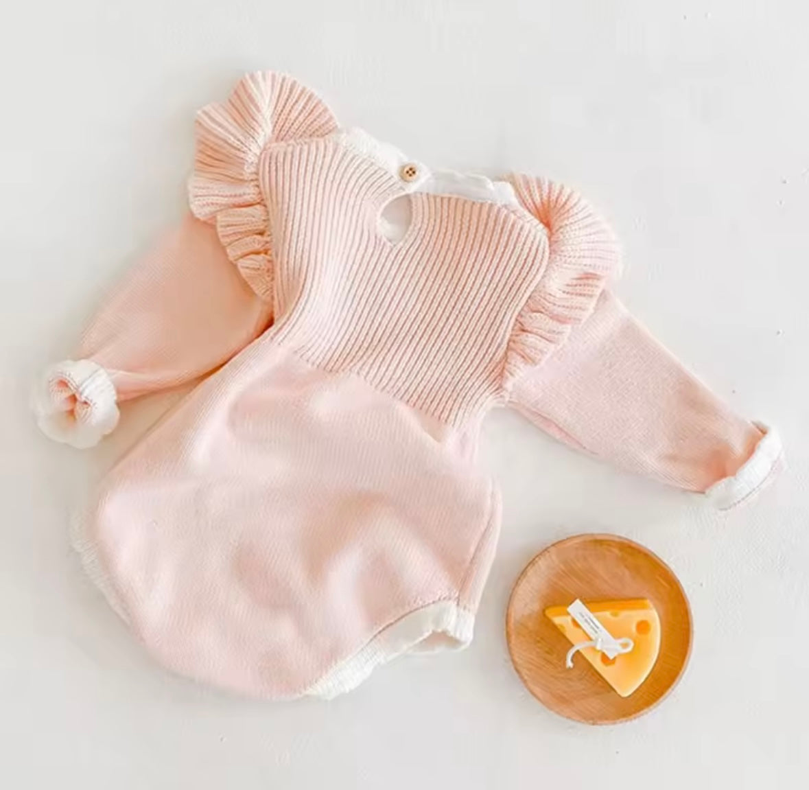 Blush Pink Knit Baby Romper with Ruffle Sleeves & Bow