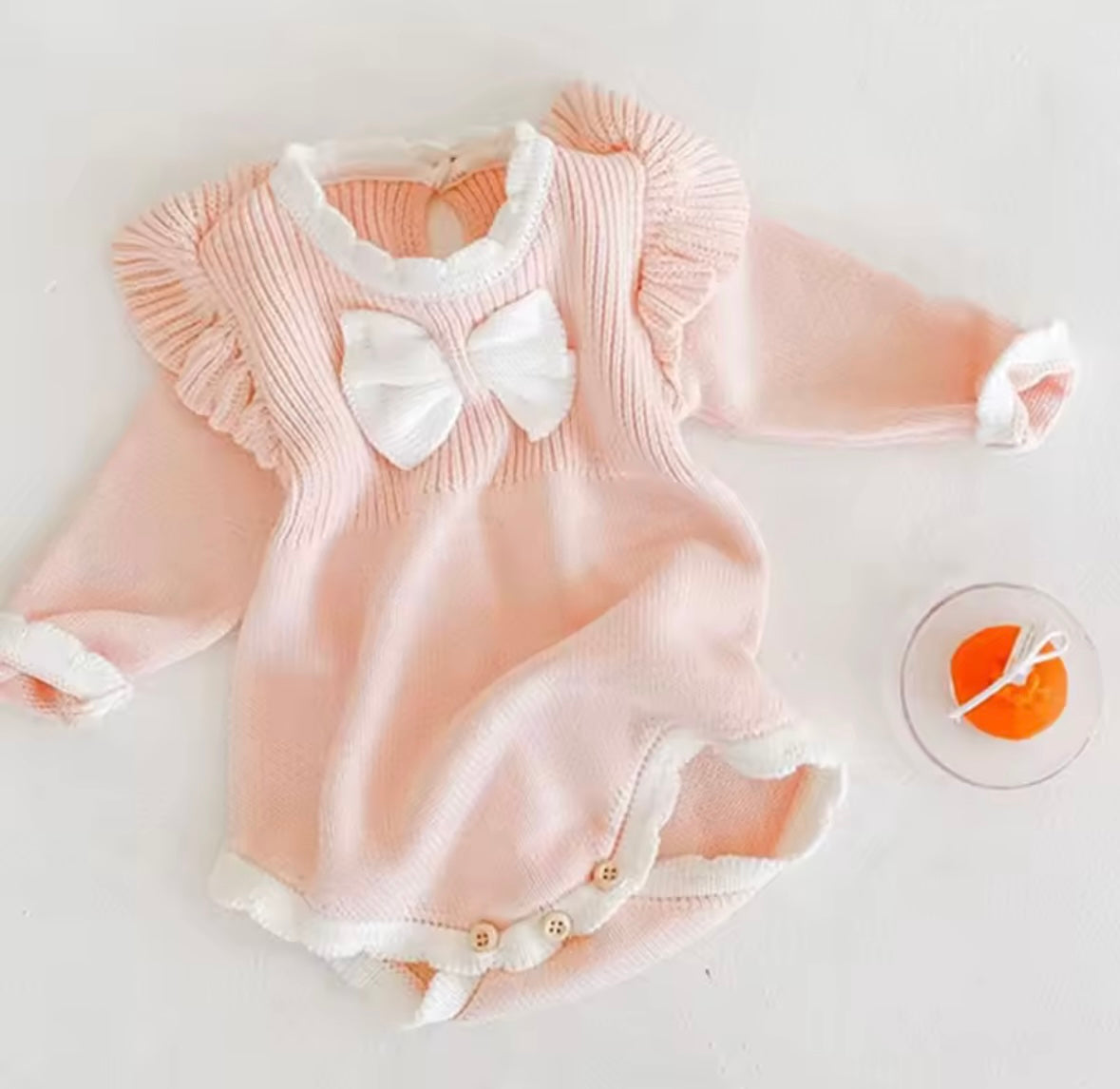 Blush Pink Knit Baby Romper with Ruffle Sleeves & Bow